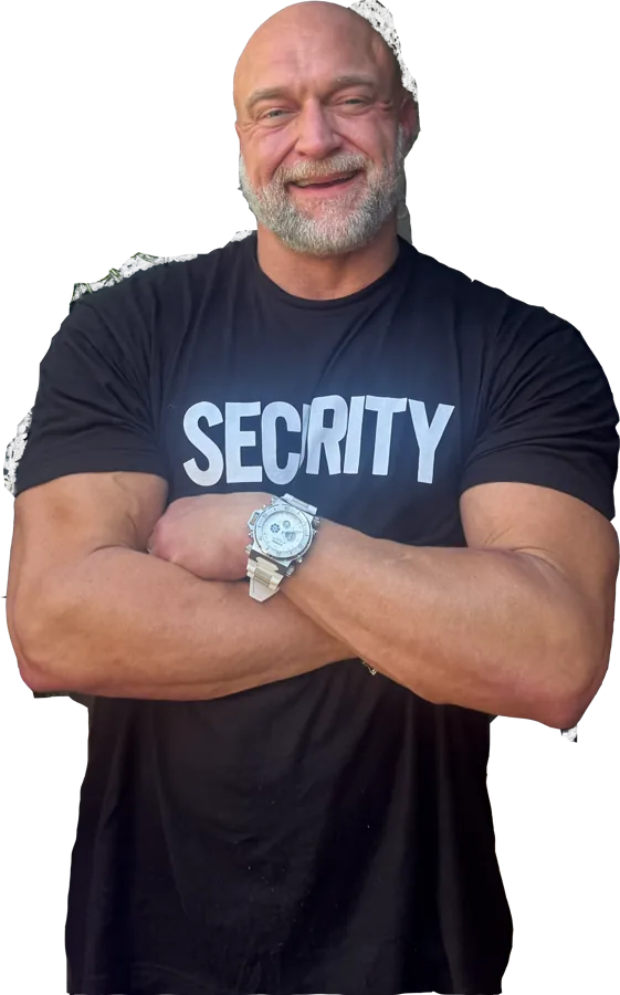 Bruno in a security T-shirt, arms crossed and grinning