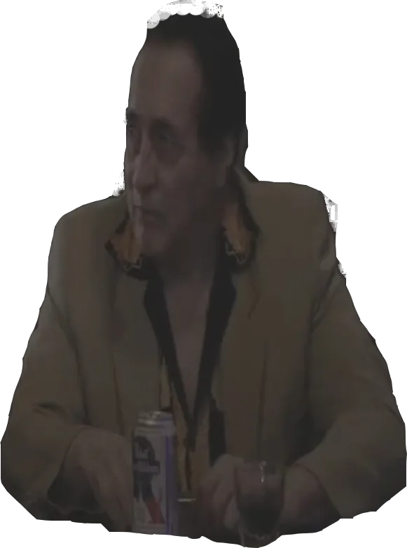 Fred in a tan jacket with a beer at the bar